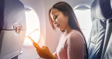 womanonairplane 370x195 (1)