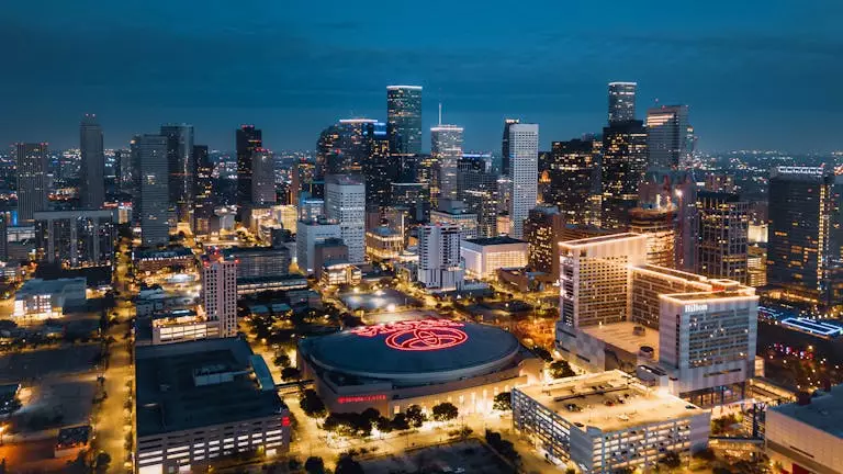 Stunning aerial panorama of Houston's illuminated skyline at night showcasing modern skyscrapers.